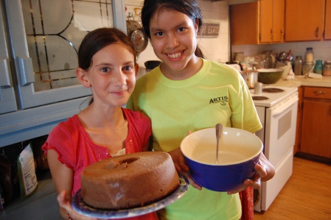 Carolina and Michelle ready to sample the chocolate cake.